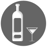 A bottle of liquor and a martini glass